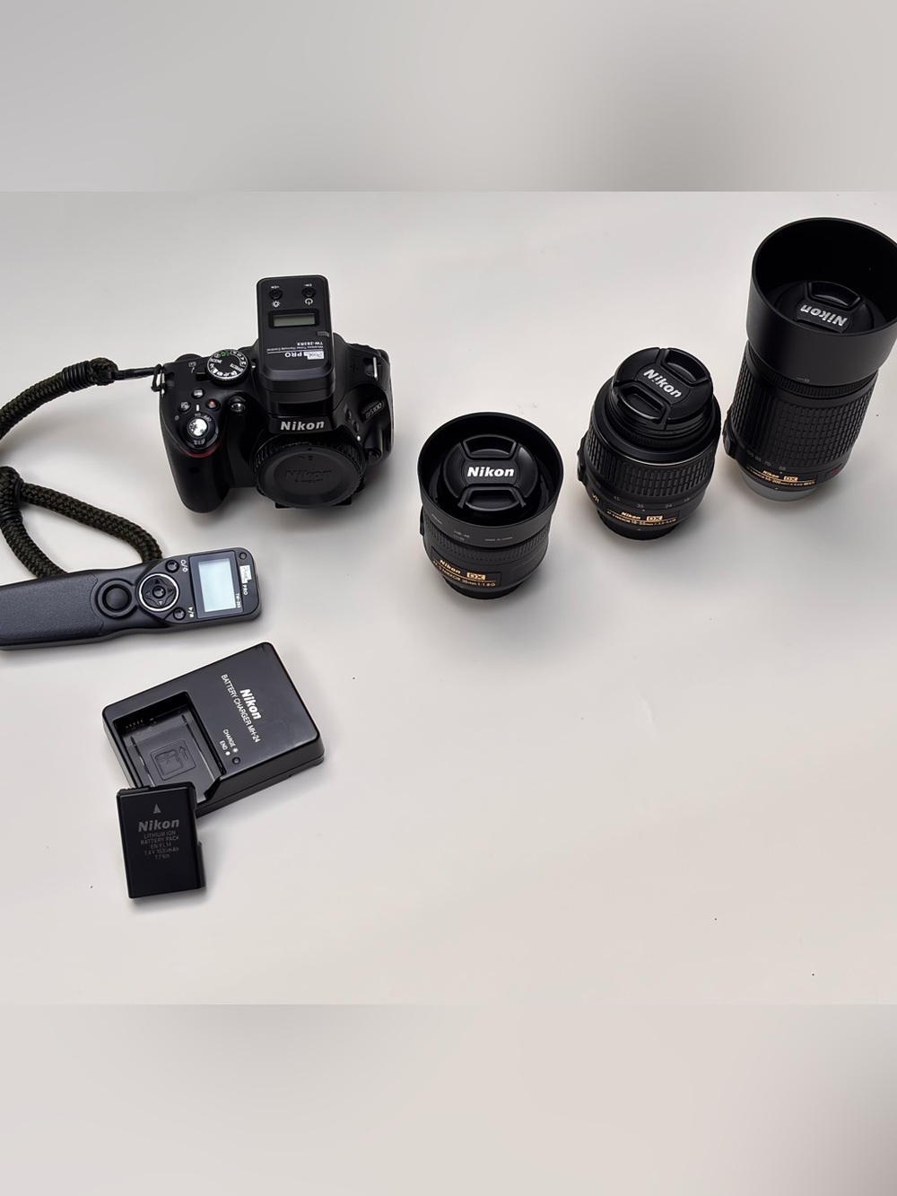 Nikon Black DSLR Camera Body with Black Lenses and Accessories